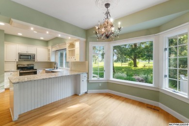 Nestled on over an acre on a scenic private drive, this on Highland Park Golf Course in Iowa - for sale on GolfHomes.com, golf home, golf lot