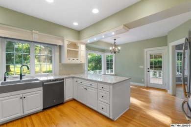 Nestled on over an acre on a scenic private drive, this on Highland Park Golf Course in Iowa - for sale on GolfHomes.com, golf home, golf lot