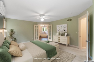 Nestled on over an acre on a scenic private drive, this on Highland Park Golf Course in Iowa - for sale on GolfHomes.com, golf home, golf lot