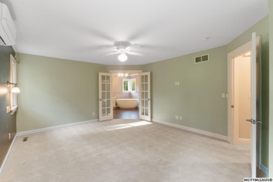 Nestled on over an acre on a scenic private drive, this on Highland Park Golf Course in Iowa - for sale on GolfHomes.com, golf home, golf lot