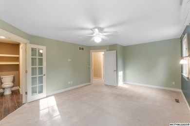 Nestled on over an acre on a scenic private drive, this on Highland Park Golf Course in Iowa - for sale on GolfHomes.com, golf home, golf lot