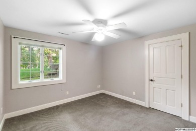 Nestled on over an acre on a scenic private drive, this on Highland Park Golf Course in Iowa - for sale on GolfHomes.com, golf home, golf lot