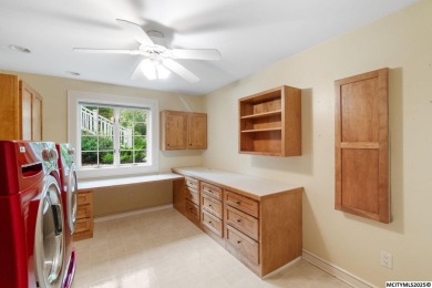 Nestled on over an acre on a scenic private drive, this on Highland Park Golf Course in Iowa - for sale on GolfHomes.com, golf home, golf lot