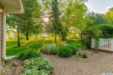 Nestled on over an acre on a scenic private drive, this on Highland Park Golf Course in Iowa - for sale on GolfHomes.com, golf home, golf lot