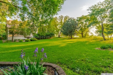 Nestled on over an acre on a scenic private drive, this on Highland Park Golf Course in Iowa - for sale on GolfHomes.com, golf home, golf lot