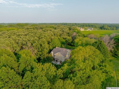Nestled on over an acre on a scenic private drive, this on Highland Park Golf Course in Iowa - for sale on GolfHomes.com, golf home, golf lot