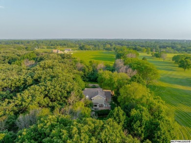 Nestled on over an acre on a scenic private drive, this on Highland Park Golf Course in Iowa - for sale on GolfHomes.com, golf home, golf lot
