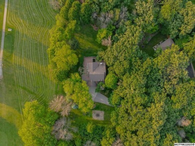 Nestled on over an acre on a scenic private drive, this on Highland Park Golf Course in Iowa - for sale on GolfHomes.com, golf home, golf lot