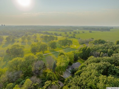 Nestled on over an acre on a scenic private drive, this on Highland Park Golf Course in Iowa - for sale on GolfHomes.com, golf home, golf lot
