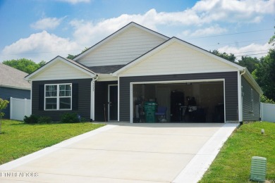 Kitchen boasts spacious cabinetry and Stainless Whirlpool range on Millstone Golf Club in Tennessee - for sale on GolfHomes.com, golf home, golf lot