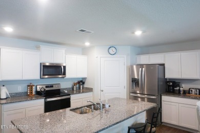 Kitchen boasts spacious cabinetry and Stainless Whirlpool range on Millstone Golf Club in Tennessee - for sale on GolfHomes.com, golf home, golf lot