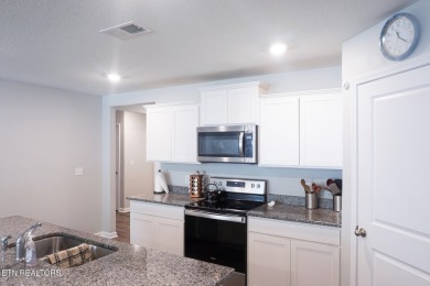 Kitchen boasts spacious cabinetry and Stainless Whirlpool range on Millstone Golf Club in Tennessee - for sale on GolfHomes.com, golf home, golf lot