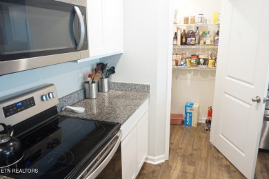Kitchen boasts spacious cabinetry and Stainless Whirlpool range on Millstone Golf Club in Tennessee - for sale on GolfHomes.com, golf home, golf lot