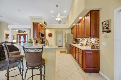 Luxury Living with Golf Course Views and Heated Saltwater Pool! on Harbor Hills Country Club in Florida - for sale on GolfHomes.com, golf home, golf lot