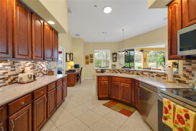 Luxury Living with Golf Course Views and Heated Saltwater Pool! on Harbor Hills Country Club in Florida - for sale on GolfHomes.com, golf home, golf lot