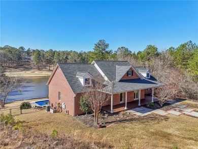 Experience luxury and convenience in this stunning lakefront on Canongate At Healy Point Country Club in Georgia - for sale on GolfHomes.com, golf home, golf lot