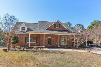 Experience luxury and convenience in this stunning lakefront on Canongate At Healy Point Country Club in Georgia - for sale on GolfHomes.com, golf home, golf lot