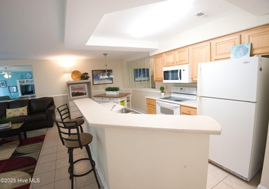 Welcome to this meticulously maintained 2-bedroom, 2-bath condo on Brunswick Plantation and Golf Resorts in North Carolina - for sale on GolfHomes.com, golf home, golf lot
