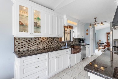 Located in the highly sought-after Boca Woods Country Club, this on Boca Woods Country Club in Florida - for sale on GolfHomes.com, golf home, golf lot