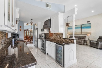 Located in the highly sought-after Boca Woods Country Club, this on Boca Woods Country Club in Florida - for sale on GolfHomes.com, golf home, golf lot