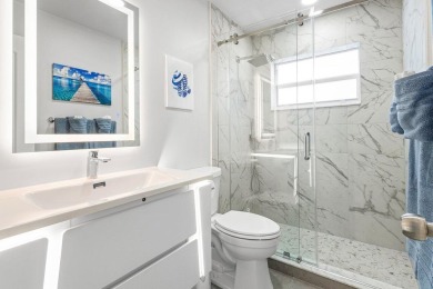 Located in the highly sought-after Boca Woods Country Club, this on Boca Woods Country Club in Florida - for sale on GolfHomes.com, golf home, golf lot