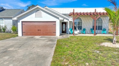 Discover your coastal retreat at Seaclusion Beach, located on Holiday Golf Club in Florida - for sale on GolfHomes.com, golf home, golf lot