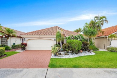 Located in the highly sought-after Boca Woods Country Club, this on Boca Woods Country Club in Florida - for sale on GolfHomes.com, golf home, golf lot