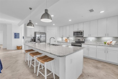 This exquisite FIRST FLOOR COACH home is just steps from one of on Heritage Landing Golf  in Florida - for sale on GolfHomes.com, golf home, golf lot