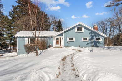 This charming 1.5-story home offers water access to Lake Iola on Glacier Wood Golf Club in Wisconsin - for sale on GolfHomes.com, golf home, golf lot