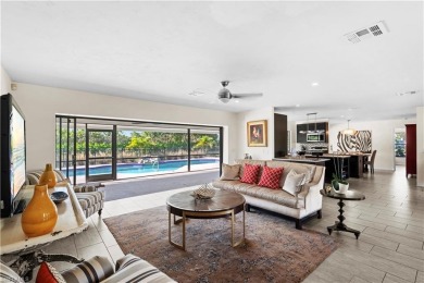 This exquisite single-family home is situated in the highly on Imperial Golf Club in Florida - for sale on GolfHomes.com, golf home, golf lot