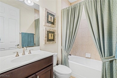 MOVE-IN READY | MAJOR UPGRADES | GOLF & WATER VIEWS! This on Herons Glen Golf and Country Club in Florida - for sale on GolfHomes.com, golf home, golf lot