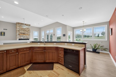 Discover this beautifully updated 4-bedroom, 3.5-bath home in on Hawks Landing Golf Club in Wisconsin - for sale on GolfHomes.com, golf home, golf lot
