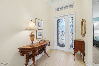 MOVE-IN READY | MAJOR UPGRADES | GOLF & WATER VIEWS! This on Herons Glen Golf and Country Club in Florida - for sale on GolfHomes.com, golf home, golf lot