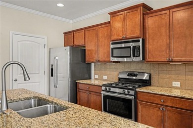 Hidden at the end of a quiet cul-de-sac in Heron Bay Villas on Canongate At Heron Bay in Georgia - for sale on GolfHomes.com, golf home, golf lot