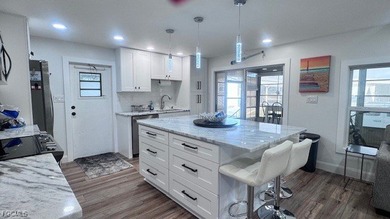 Experience luxury living in this beautifully remodeled on Riverbend Golf and Country Club in Florida - for sale on GolfHomes.com, golf home, golf lot