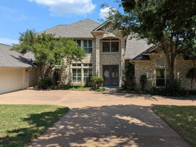 Stately 2 story limestone home on almost 2 sloping acres to the on Pecan Plantation Country Club in Texas - for sale on GolfHomes.com, golf home, golf lot