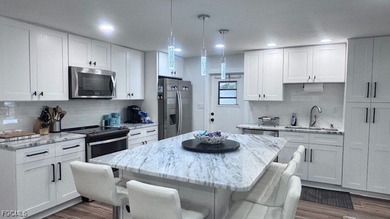 Experience luxury living in this beautifully remodeled on Riverbend Golf and Country Club in Florida - for sale on GolfHomes.com, golf home, golf lot