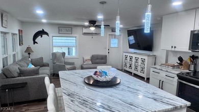 Experience luxury living in this beautifully remodeled on Riverbend Golf and Country Club in Florida - for sale on GolfHomes.com, golf home, golf lot