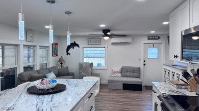 Experience luxury living in this beautifully remodeled on Riverbend Golf and Country Club in Florida - for sale on GolfHomes.com, golf home, golf lot