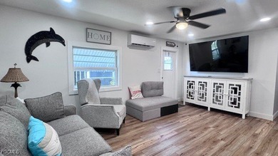 Experience luxury living in this beautifully remodeled on Riverbend Golf and Country Club in Florida - for sale on GolfHomes.com, golf home, golf lot