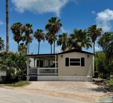 Cute and nicely updated park model featuring large full length on Long Island Golf Course in Texas - for sale on GolfHomes.com, golf home, golf lot