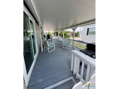 Cute and nicely updated park model featuring large full length on Long Island Golf Course in Texas - for sale on GolfHomes.com, golf home, golf lot