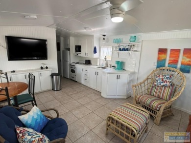 Cute and nicely updated park model featuring large full length on Long Island Golf Course in Texas - for sale on GolfHomes.com, golf home, golf lot