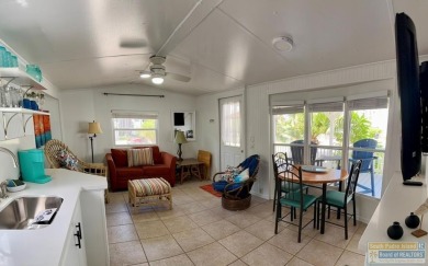 Cute and nicely updated park model featuring large full length on Long Island Golf Course in Texas - for sale on GolfHomes.com, golf home, golf lot