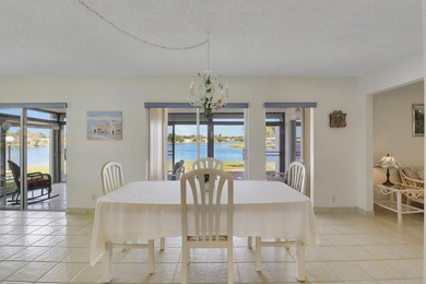 Welcome to one of the most unique waterfront homes in Cypress on Cypress Lakes Golf Course - West Palm Beach in Florida - for sale on GolfHomes.com, golf home, golf lot