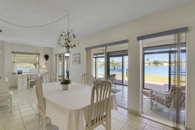 Welcome to one of the most unique waterfront homes in Cypress on Cypress Lakes Golf Course - West Palm Beach in Florida - for sale on GolfHomes.com, golf home, golf lot