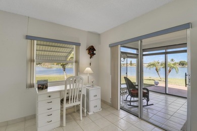 Welcome to one of the most unique waterfront homes in Cypress on Cypress Lakes Golf Course - West Palm Beach in Florida - for sale on GolfHomes.com, golf home, golf lot