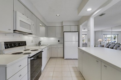 Welcome to one of the most unique waterfront homes in Cypress on Cypress Lakes Golf Course - West Palm Beach in Florida - for sale on GolfHomes.com, golf home, golf lot