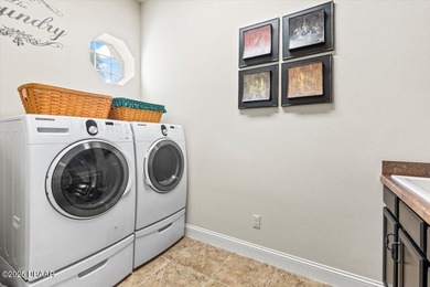 SITED ON PARK-LIKE GROUNDS WITHIN PROMENADE PARKE, THE on Venetian Bay Golf Course in Florida - for sale on GolfHomes.com, golf home, golf lot