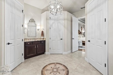 SITED ON PARK-LIKE GROUNDS WITHIN PROMENADE PARKE, THE on Venetian Bay Golf Course in Florida - for sale on GolfHomes.com, golf home, golf lot